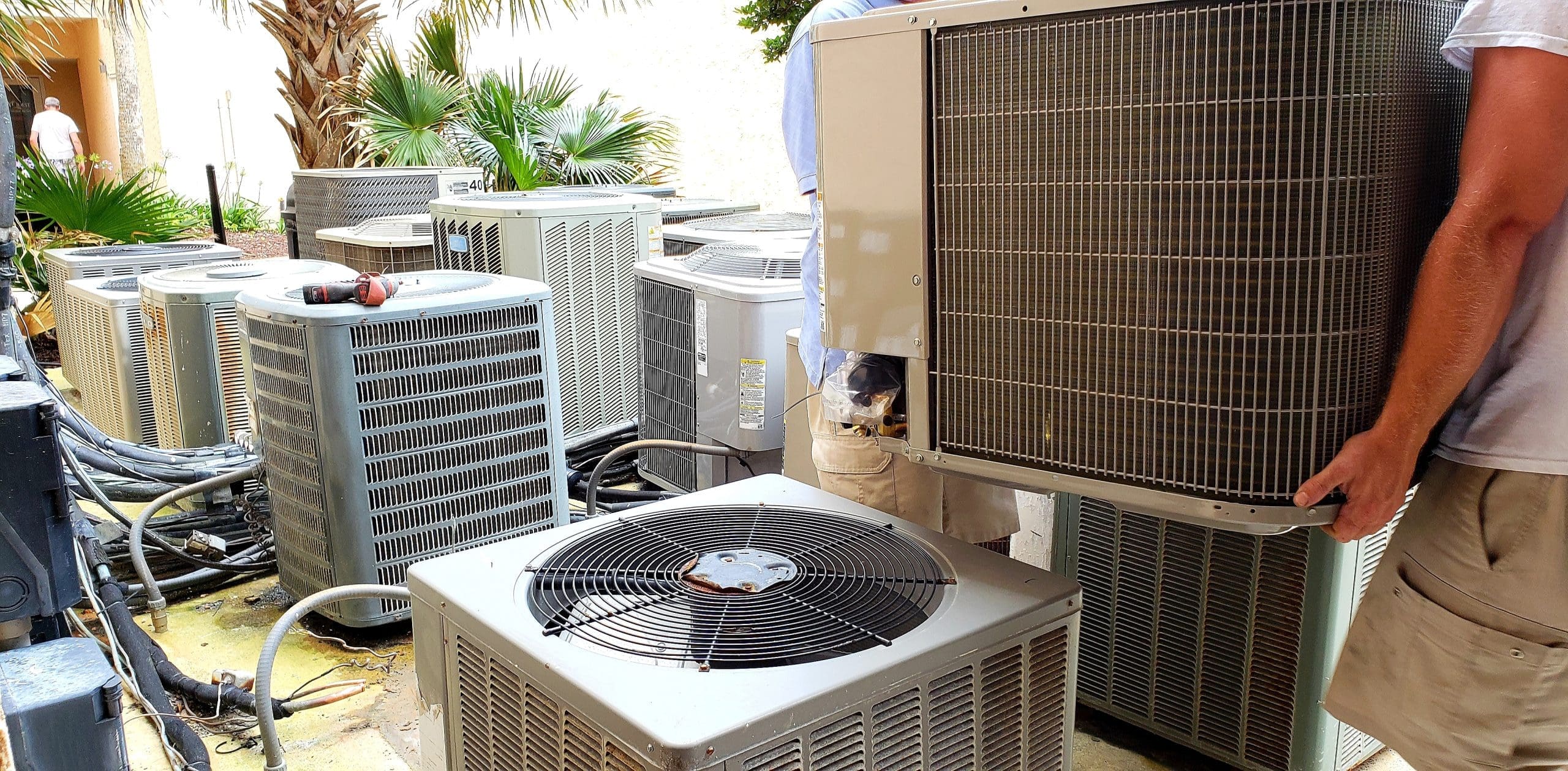 hvac-technician-removing-old-rusted-broken-aircond-2022-11-12-09-50-49-utc